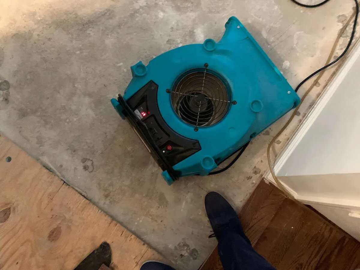 Air mover drying subfloor during Commercial Water Damage Restoration in Frankfort Square